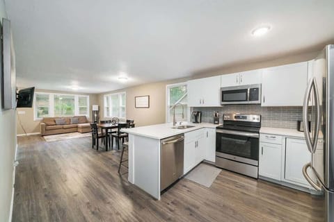 Updated Kitchen with Stainless Steel Appliances and Quartz counter-top