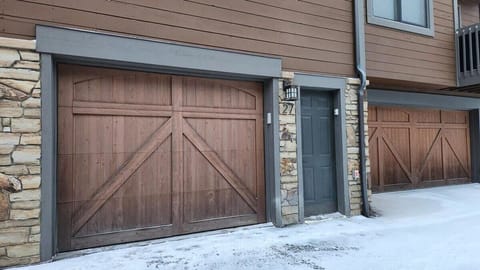 The view of the outside of the home includes the front door and the garage where guests will have access to parking.