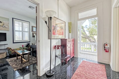 Upstairs hallway & master suite, looking out onto upper porch