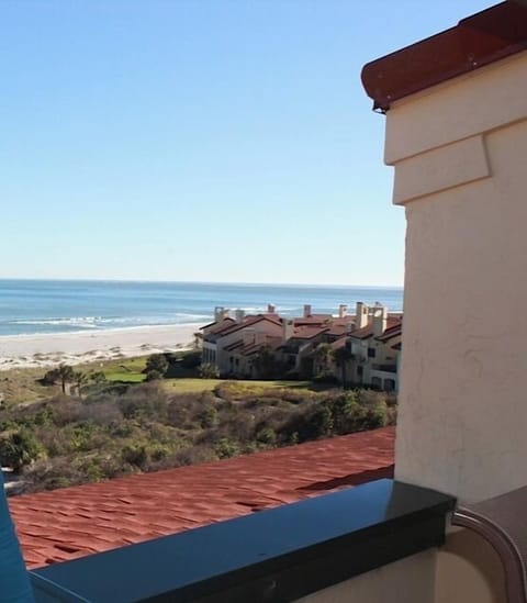 View of beach looking south from porch -wall & roof
