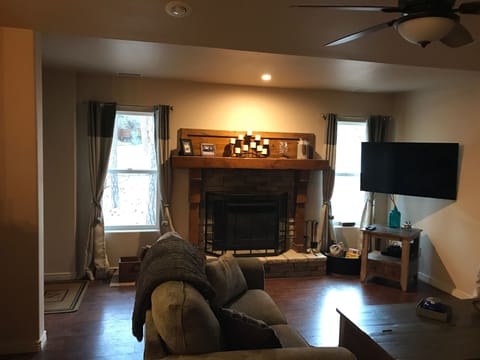 Living room for lounging, watching a movie by the fire or a football game