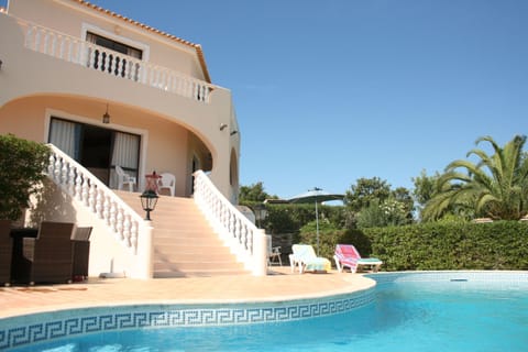 The majestic staircase and poolside from which to relax and admire the views