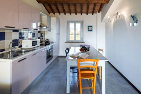 Property, Furniture, Cabinetry, Sink, Countertop, Kitchen Stove, Interior Design, Table, Wood, Kitchen Appliance