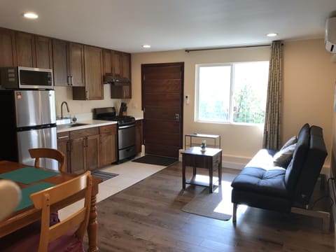 Front entrance door.  Living, dinning and kitchen are in a welcome open space.