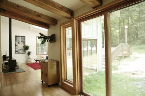 From kitchen. Vintage bar contains cocktail glasses and shaker.