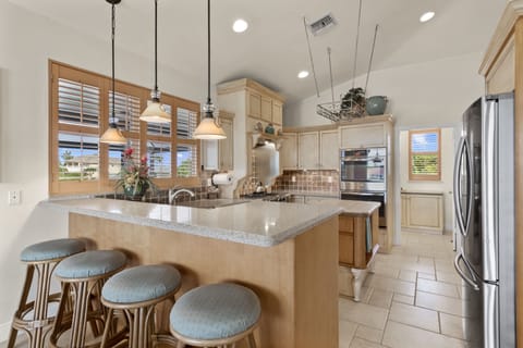 View of kitchen and door to laundry/pantry.
