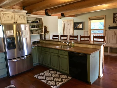 Long bar with 5 bar stools.  Long bench with cubbies lining the two entry walls.