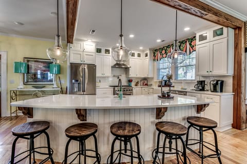 Extra dining seats + kitchen island seating for easy serving