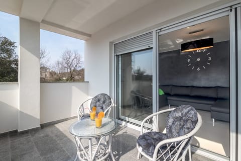 Relax on a patio with a glass of cold juice or wine