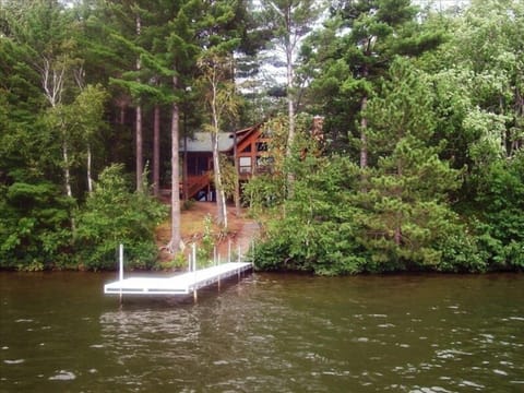 Back of lakehouse off of 20 ft. dock, 2-3 ft deep on sides, end-drops to 9 ft