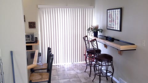 This sliding door opens on to the courtyard with hot tub.  Kitchenette to left.