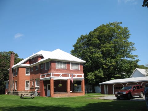 Spacious backyard, parking, patio, grill and picnic area.