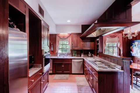 Equipped Kitchen w/ 6 burner stove, oven, microwave, dishwasher & refrigerator.