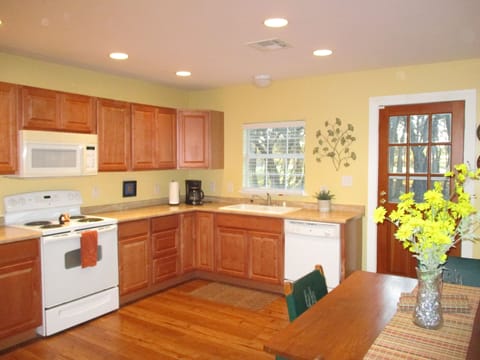 The kitchen is roomy, clean and ready.