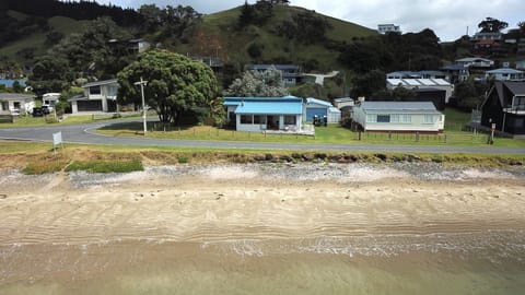 Absolute beachfront with single lane residents access road in front