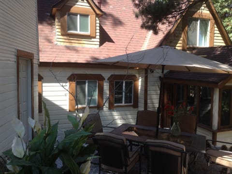 private back patio with dining table and bbq/new addition