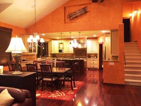 Large open floorplan with gourmet kitchen, dining, living room & bar area