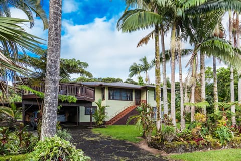 A charming Hawaiian Home nestled in lush landscape