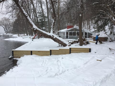 snowy view of the house from the extra lot.