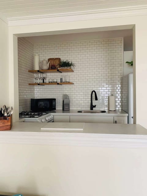 Upstairs Kitchen- Additional prep and coffee space for your convenience.