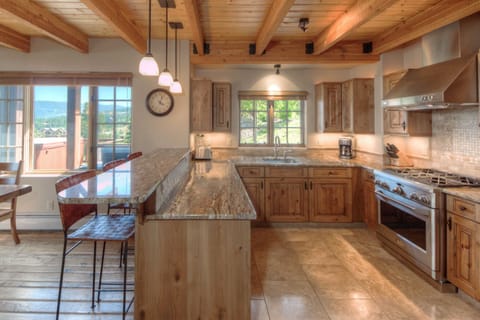 Large open kitchen with heated floors, top of the line appliances