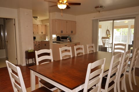 From the 3 season room, step into the eat in kitchen area with seating for 10.