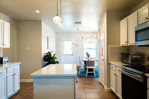 Kitchen and welcoming dining area.
