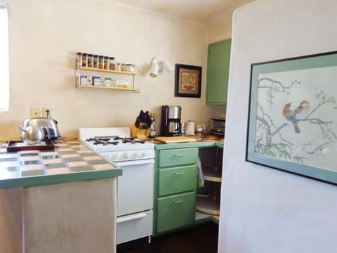 Kitchen with silk painting in the foreground