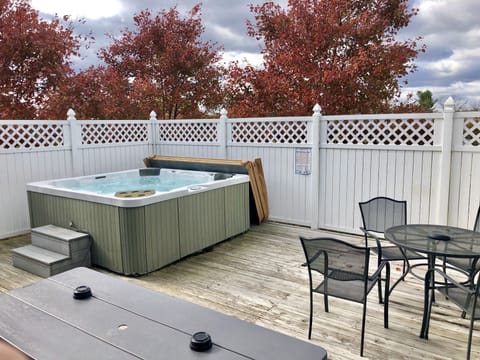 400 sq ft deck with 6 private 6 person hot tub and seating for 10