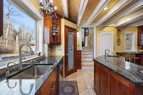 Kitchen. View of steps up to a full bath and 2 bedrooms. 1-Queen and full futon