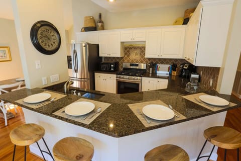 The cozy kitchen counter easily seats 4 people.