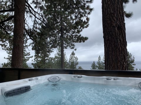Hot tub with lake view (cloudy day).  