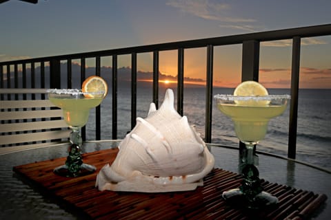 Enjoy cocktails and a beautiful sunset on your private lanai