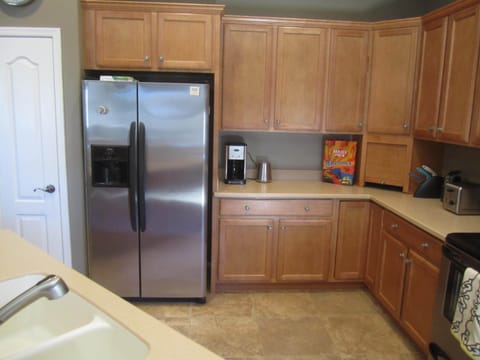Pantry, fridge, and plenty of cabinets.