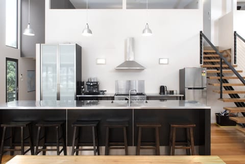 Chiefs kitchen with quality appliances and coffee machine.