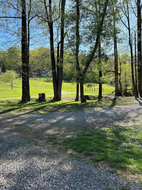 View of parking from front porch and owner's home in background