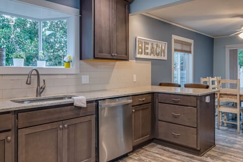 Kitchen With Quartz Countertops and Full Size Dishwasher