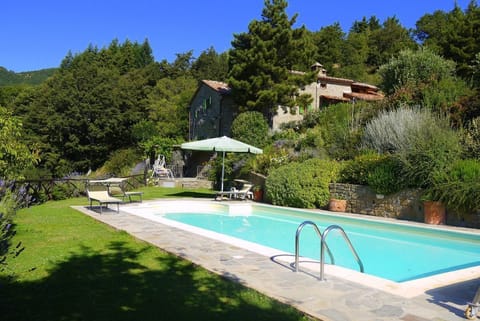 Privacy and tranquillity - the house,pool and garden view from the pool.