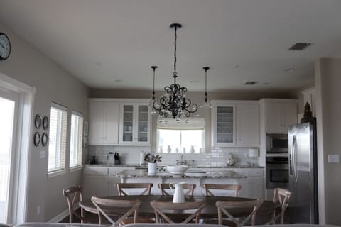 Fully equipped kitchen with tons of seating and exit to huge porch. 