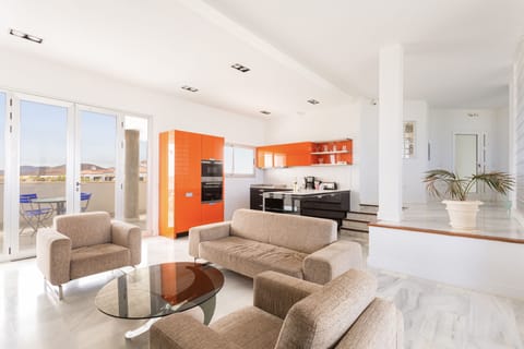 The living room and kitchen! Modern and fully equipped!