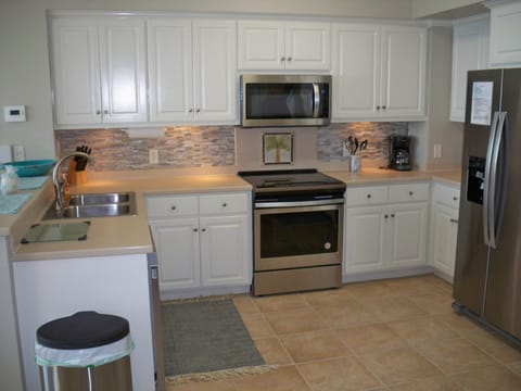 Kitchen with awesome backsplash and cute dishes