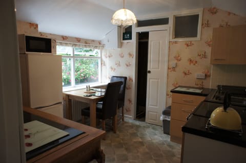 Table for two in front of the window, a fridge/freezer - real self catering