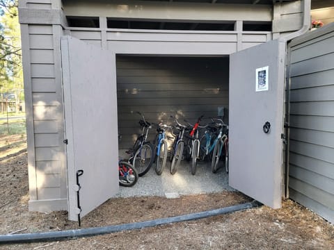 12 adult bikes, 2 junior bikes and a tricycle locker