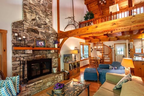 Open Concept Living Area with Stone Fireplace