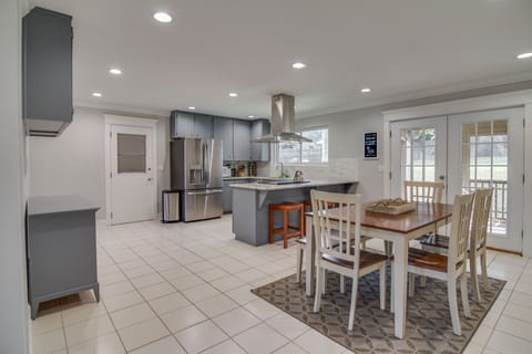 Updated Dining Room & Kitchen w/ stainless fridge, oven, and range hood.