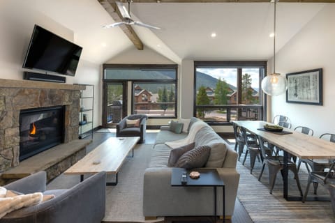 Great room with fireplace and ski slope views