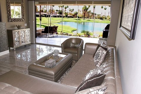 Modern "Hollywood Glam" Living Room overlooks view of lake/golf course/mountains