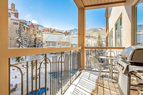 The deck, located off the living room, overlooks the year round pool and hot tub area.