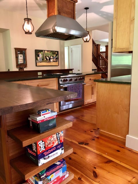 View of Kitchen from Living Room with Game Shelf