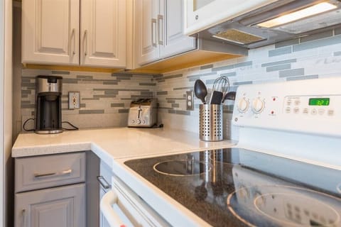 Eat in kitchen with high counter top and seating